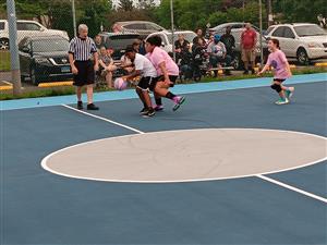 white shielding the ball from pink