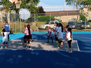 Pink team about to make a basket