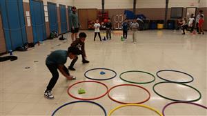 Coach Pete looks on as the boys battle it out