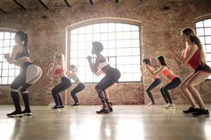 Group of women doing squat exercises
